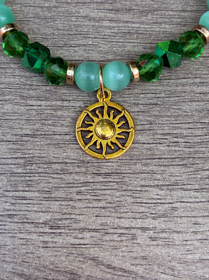 Green Cat's Eye Beaded Bracelet featuring Gold Sun Dial Charm- Size Large