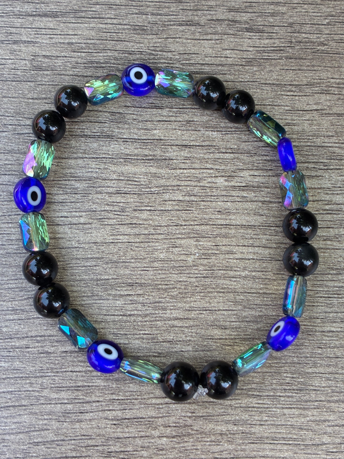 Obsidian & Metallic Blue Beaded Bracelet featuring an Evil Eye bead- Size Large