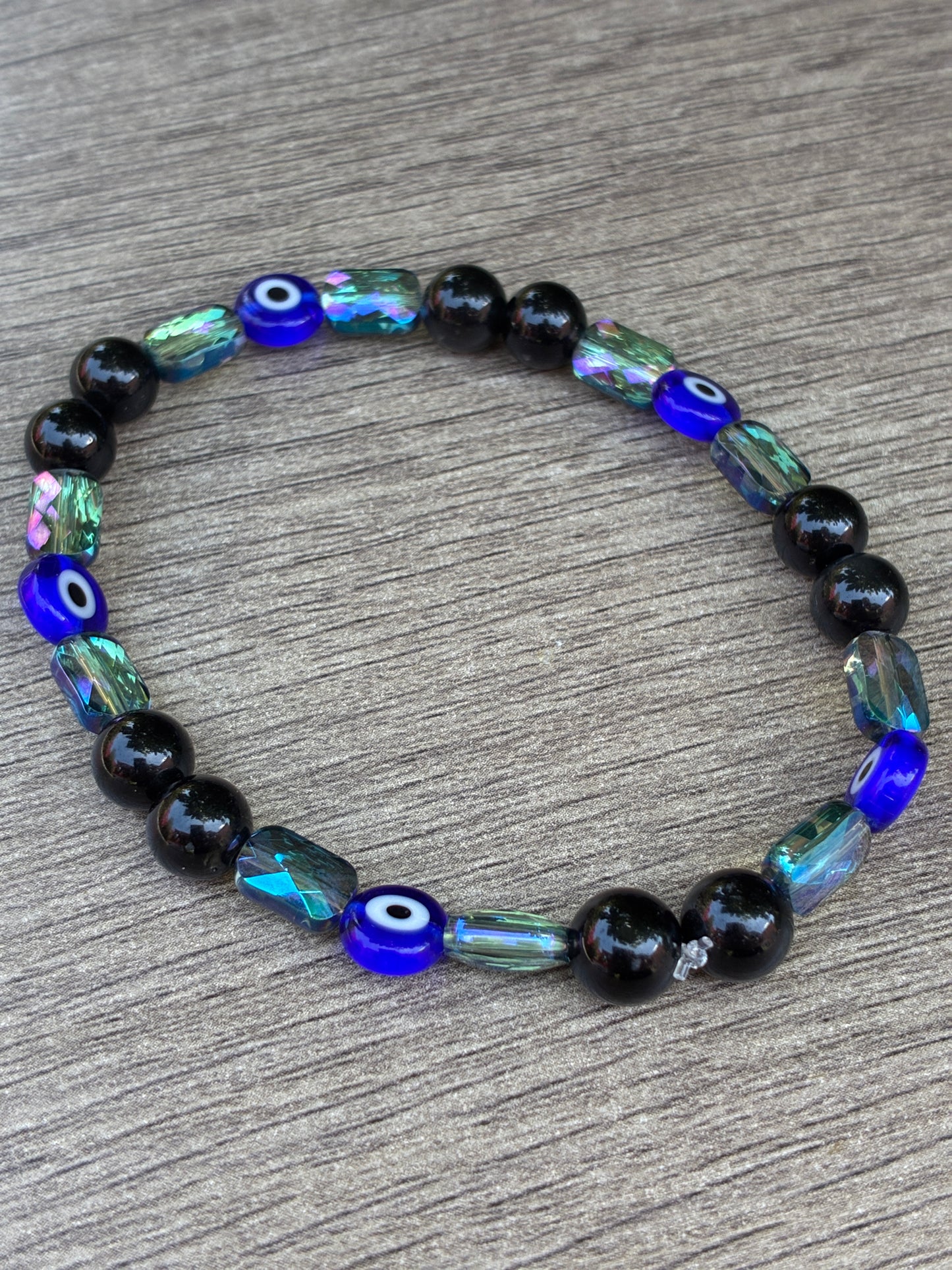 Obsidian & Metallic Blue Beaded Bracelet featuring an Evil Eye bead- Size Large